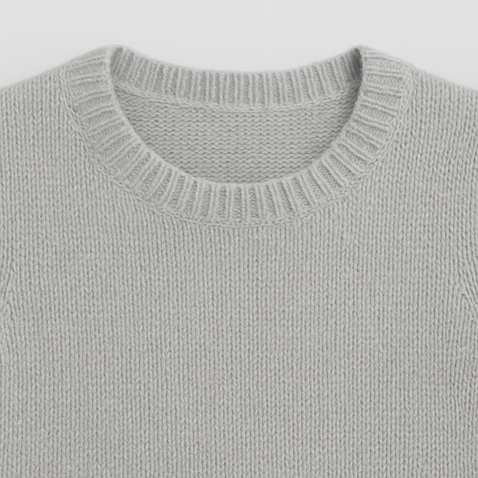 Light grey short-sleeve knit top with crew neck and ribbed trims.